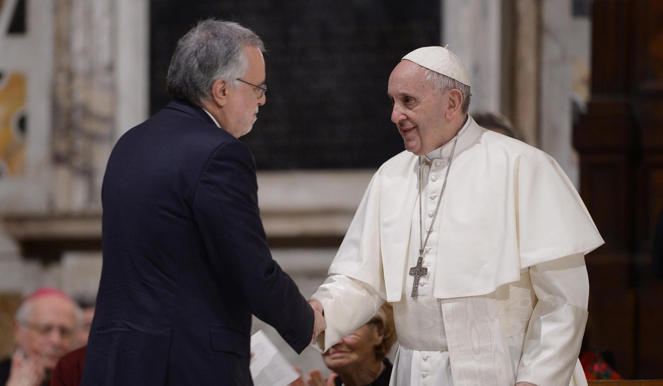 Pope Francis (R) shakes hands with Andrea Riccardi, founder of the St Egidio community, during a meeting with the St Egidio charity to mark its 50th Anniversary. Photo: EPA-EFE/POOL