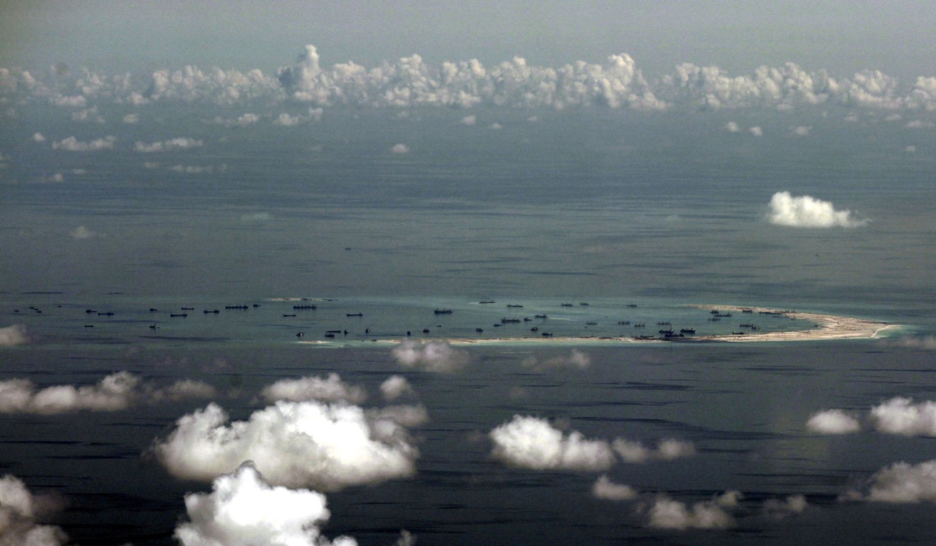 An aerial photo taken from a Philippine military plane shows land reclamation by China on Mischief Reef in the South China Sea on May 11, 2015. Photo: Reuters