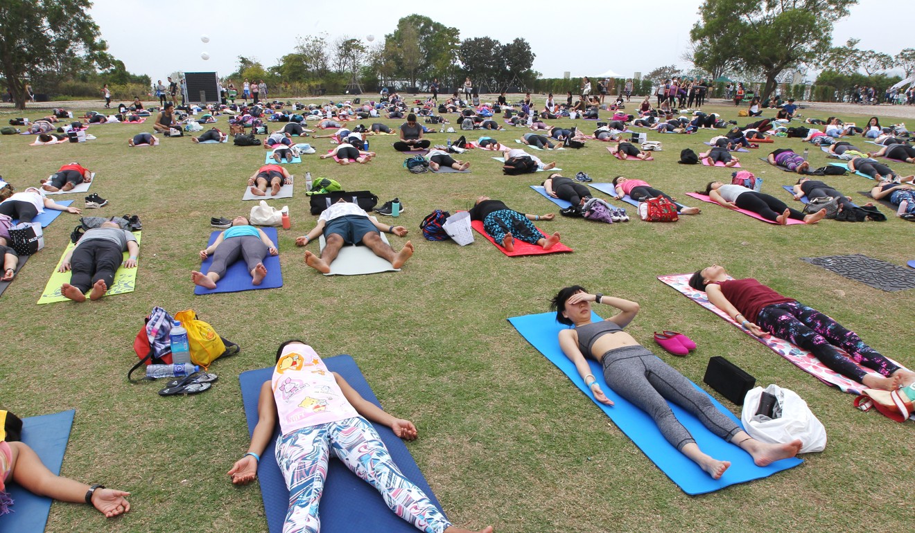 Yoga practitioners at Nursery Park in West Kowloon. Photo: Roy Issa