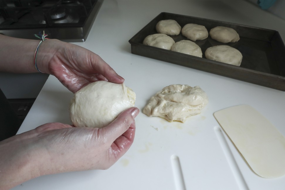 The dough is cut into eight pieces and shaped before being baked.
