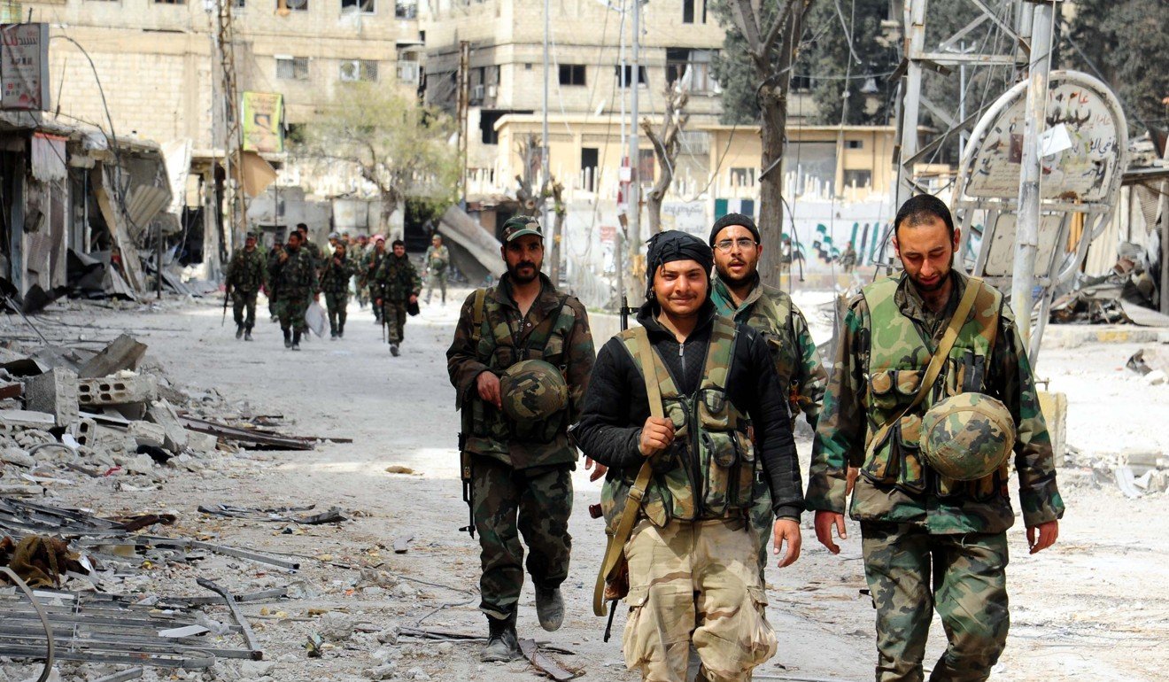 Syrian soldiers march in the town of Saqba, Syria. Photo: Xinhua
