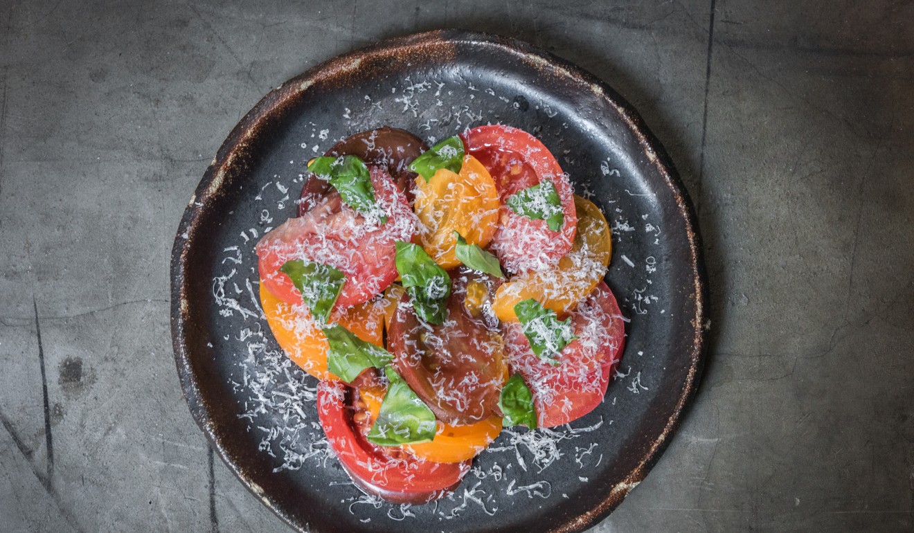 Heirloom tomatoes, sweetened soy sauce, parmesan and basil at Rhoda. 