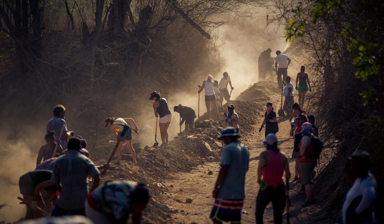 The 109 World members work with locals to help set up a water distribution system in Playa Gigante, Nicaragua. Photo: Courtesy 109 World