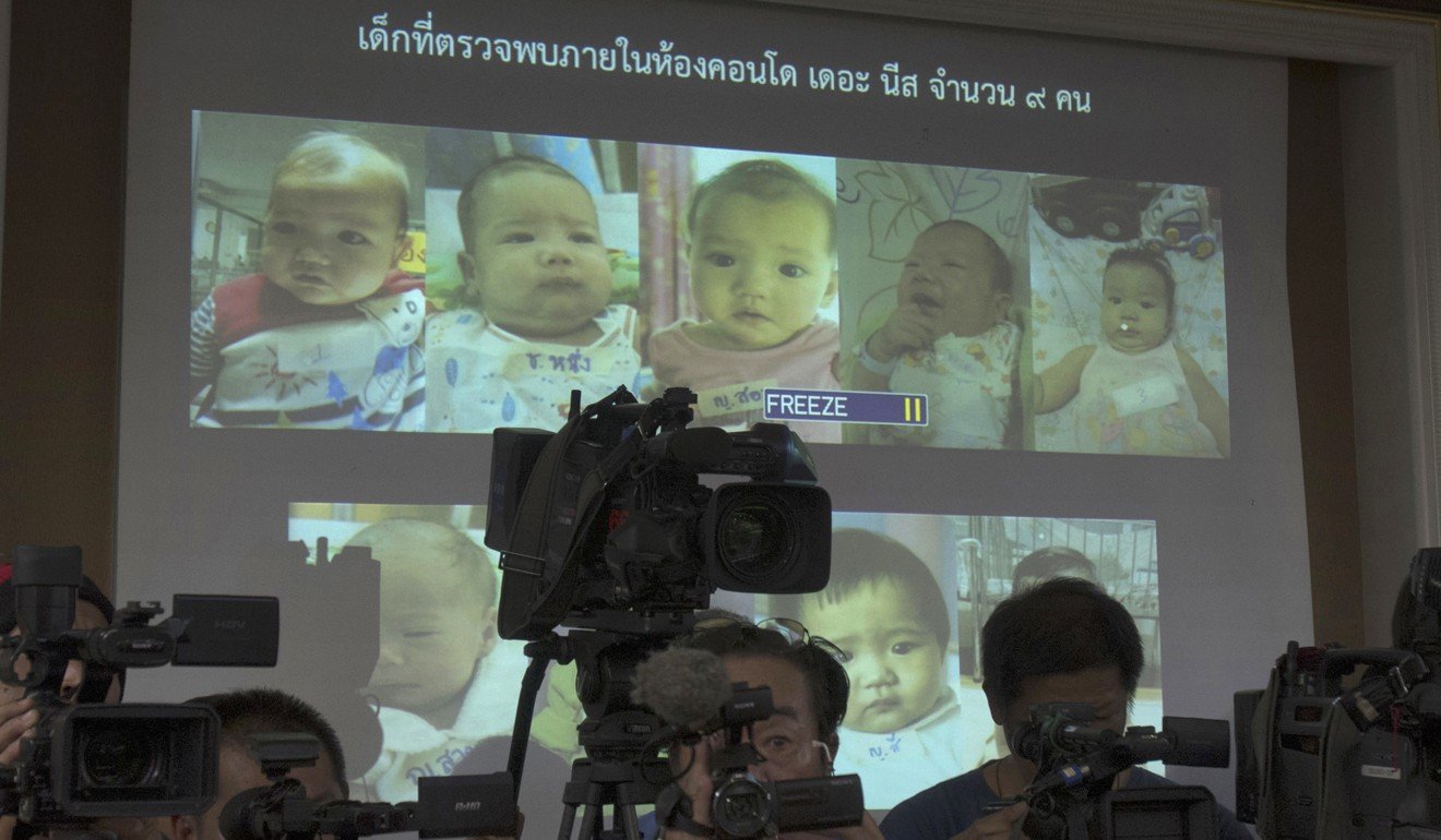 A press briefing in Bangkok where Thai police display pictures of surrogate babies born to Japanese man Mitsutoki Shigeta. Photo: AP