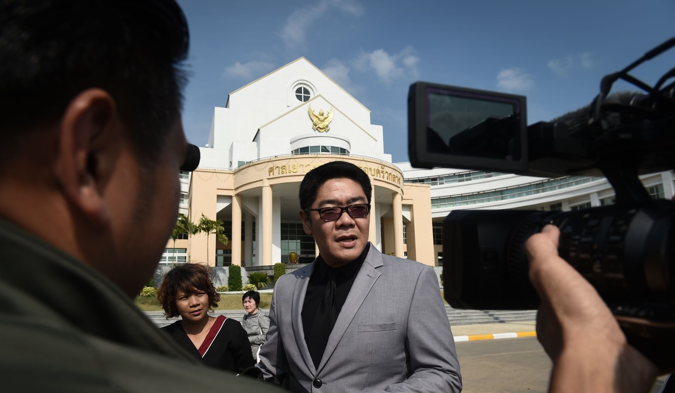 Kong Suriyamontol, the Thai lawyer for Japanese national Mitsutoki Shigeta, speaks to the press after his client was granted paternity rights to his children in Bangkok, Thailand. Photo: AFP