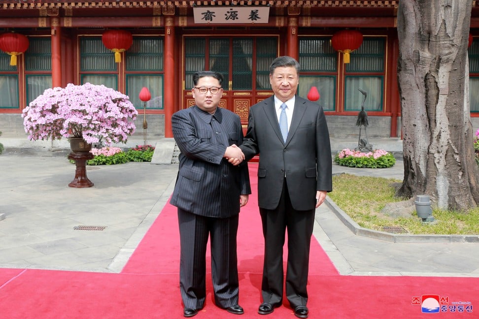 Xi Jinping (right) suggested China and North Korea enhance communications on key strategic issues, promote regional peace and strengthen exchanges between ordinary people. Photo: Reuters