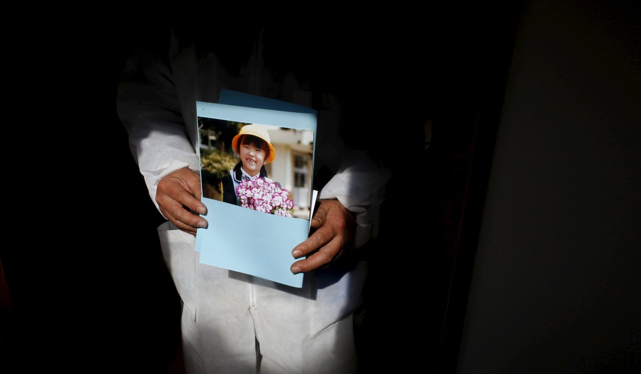 Norio Kimura, 50, who lost his father, wife and younger daughter in the 2011 tsunami, at a temple near the Fukushima Daiichi nuclear power plant. Many believe Japan should put an end to its nuclear industry once and for all. Photo: Reuters