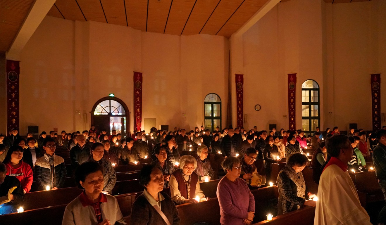 Chinese Catholics attend the Easter Vigil at a church in Shanghai. Photo: Reuters
