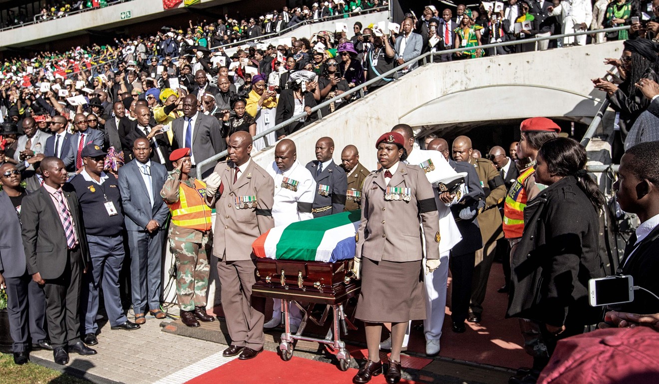 South African military personnel bring in the coffin of Winnie Madikizela-Mandela at Orlando Stadium for the funeral ceremony in Soweto. Photo: AFP