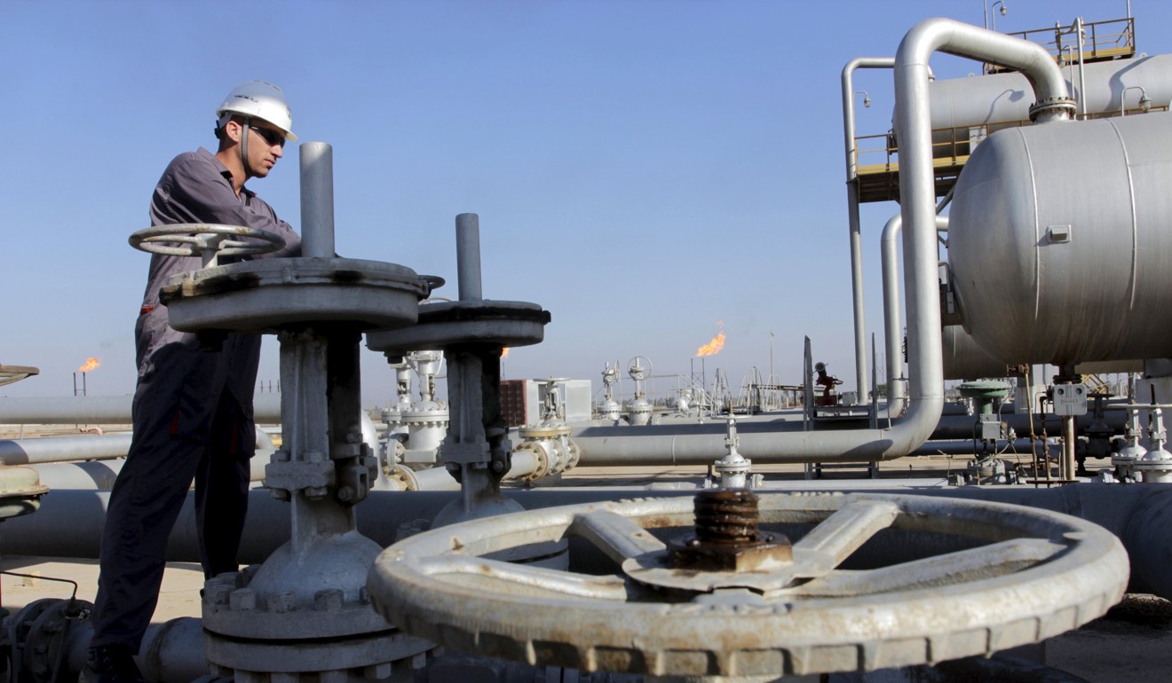 A labourer works at the Nahr Bin Umar oil field, north of Basra, Iraq, in November 2014. India signed a deal to buy about 160,000 barrels of crude a day in 2016 from Iraq, imports that a weakening dollar would make cheaper. Photo: Reuters