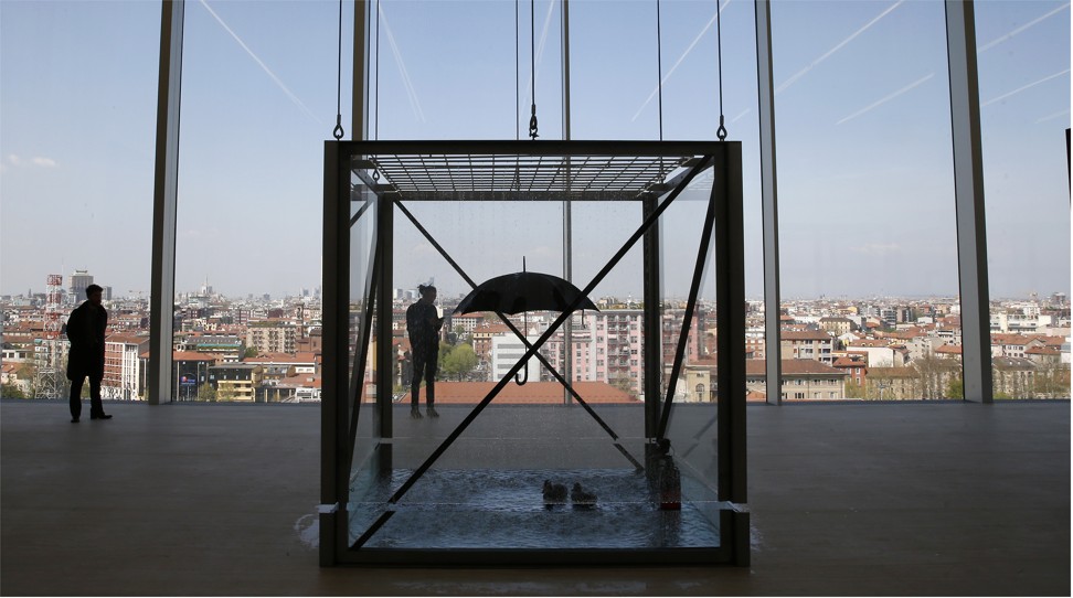 Damien Hirst’s installation ‘Tears for Everybody’s Looking at You’ – an umbrella and floating rubber ducks – on the eighth floor of Dutch architect Rem Koolhaas’ nine-storey tower built for the Prada Foundation in Milan. Photo: AP  