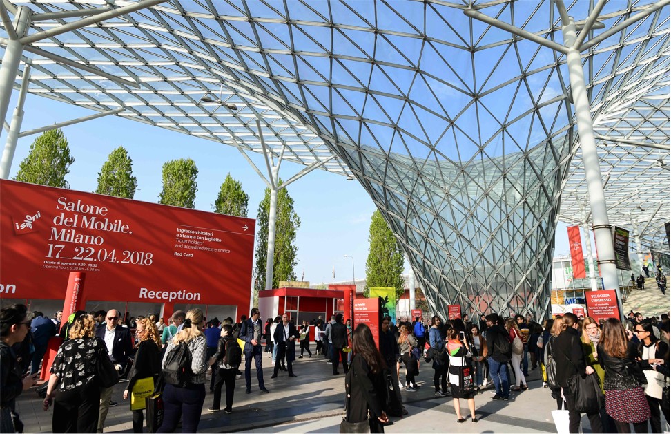 People arrive on the first day of the Salone del Mobile furniture fair in Milan on Tuesday. Photo: AFP