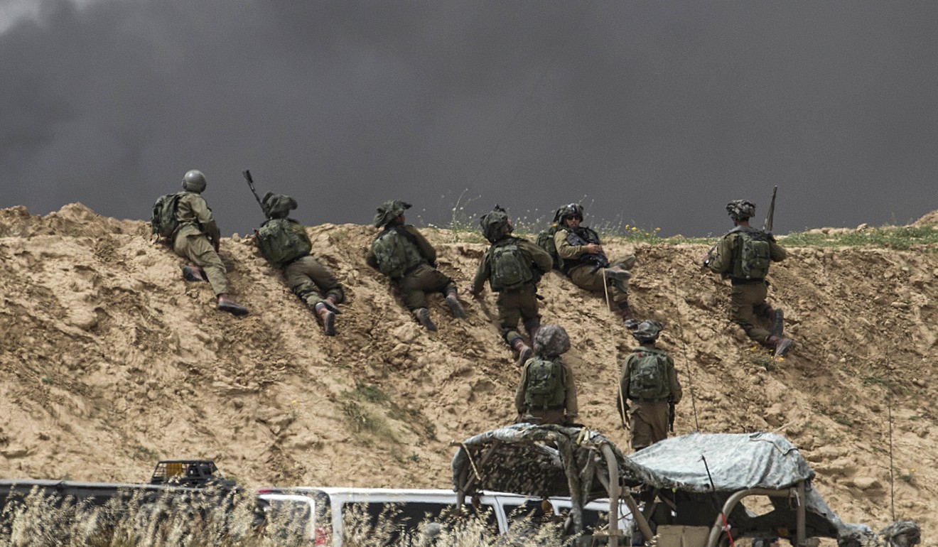 Israeli soldiers are seen taking positions during protests along Israel’s Gaza border on April 20, 2018. Photo: AP 