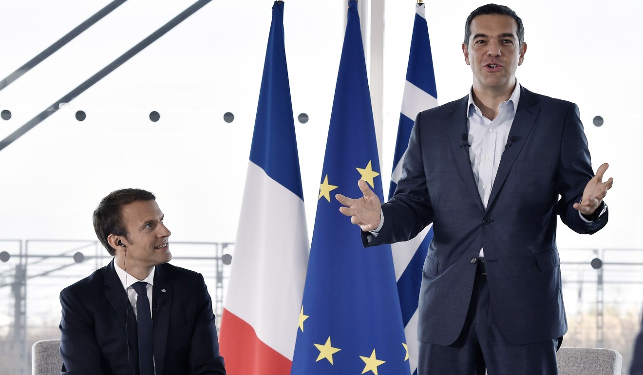Greek Prime Minister Alexis Tsipras (right) speaks during a roundtable discussion with French President Emmanuel Macron and business leaders in Athens in September2017. France's president has called for greater European investment in Greece to help offset the cash-strapped country's increasing reliance on non-European countries, notably China. Photo: AP