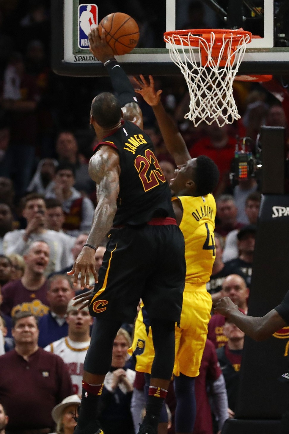 LeBron James blocks Victor Oladipo’s shot late in the game. Photo: AFP