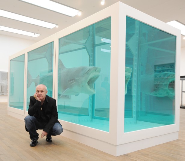 Damien Hirst with his most famous work, “The Physical Impossibility of Death in the Mind of Someone Living”, at the Tate Modern in London in 2012. Photo: Corbis