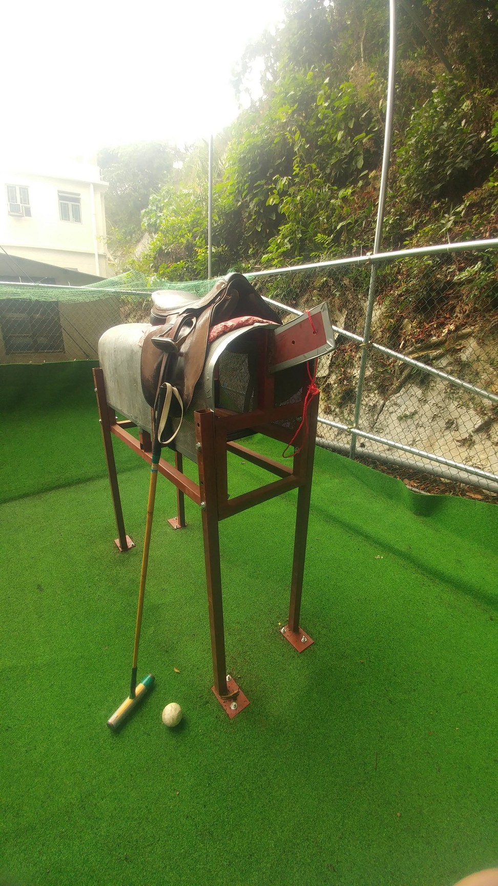 The wooden practice horse built by Andrew Leung in his backyard.