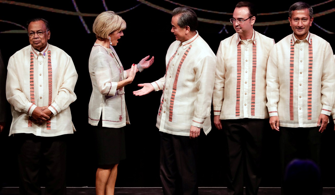 China's foreign minister, Wang Yi (centre), and Australia’s foreign minister, Julie Bishop, share a warm moment at the Association of South East Asian Nations foreign ministers' meeting in Manila, Philippines, in August 2017. Bishop has not paid a visit to China in two years, despite the large volume of trade between the two countries. Photo: Reuters 