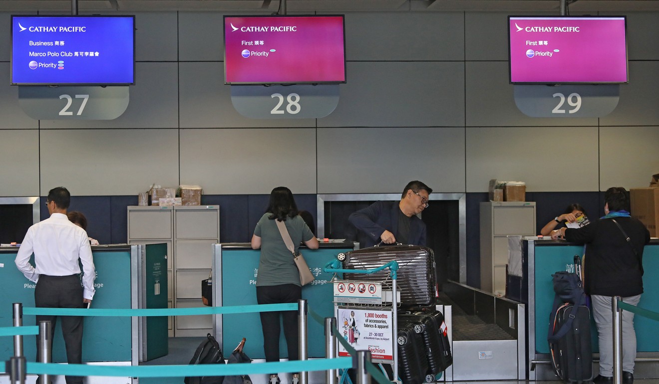 Passengers checking in baggage at Cathay Pacific Airways counters at Hong Kong station. Photo: Sam Tsang