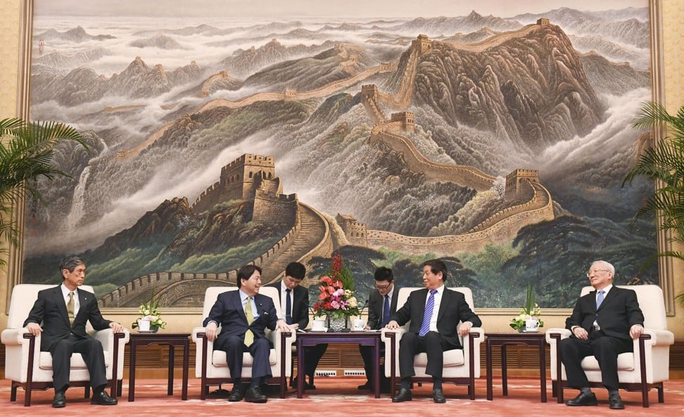 China’s top legislator Li Zhanshu (second from right) meets Yoshimasa Hayashi (second from left), chairman of the Japan-China Parliamentarians’ Union, in Beijing on Thursday. Photo: Kyodo
