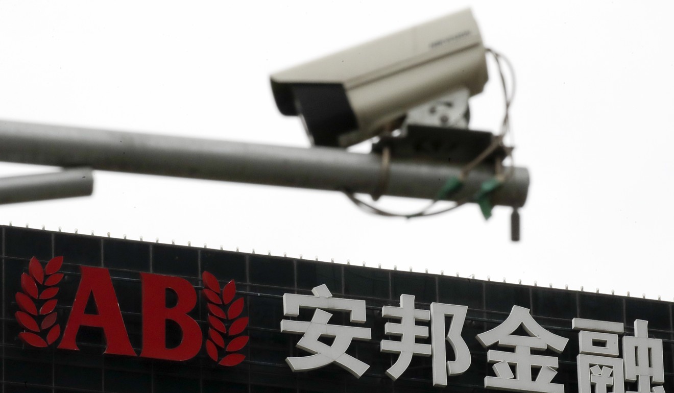 A surveillance camera is seen in front of the Anbang Insurance Group office building in Beijing, China, on April 4. Chinese companies would rather sell off assets than keep them if the Chinese government disapproves. Photo: AP 