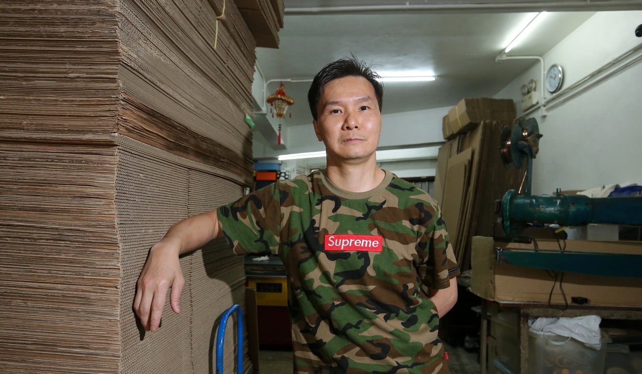 Fung Chi-Shing, a shop owner who also lives in the area, would rather not have the tourism attractions in his neighbourhood. Photo: Edmond So