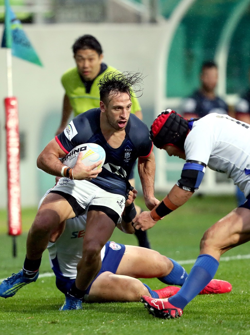 Hong Kong centre Tyler Spitz is in the thick of the action against South Korea.