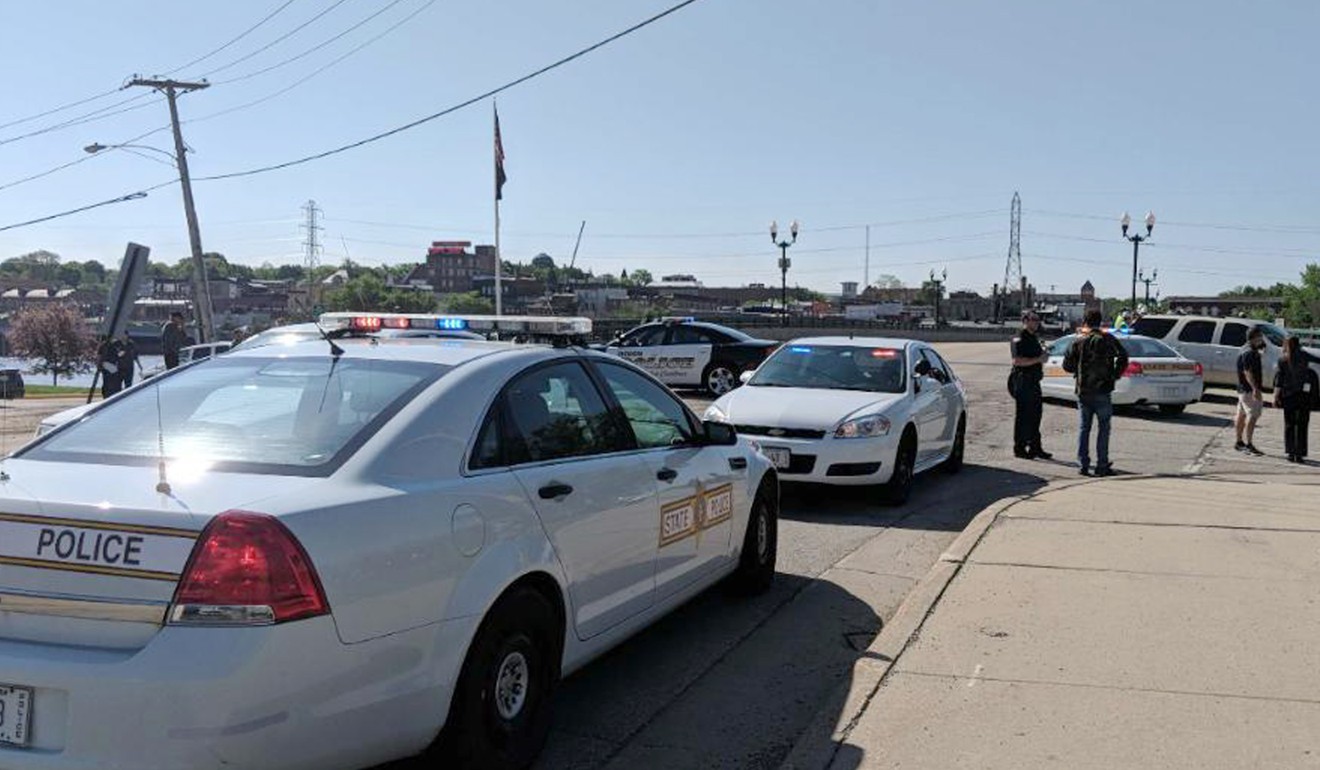 Police cars appear outside Dixon High School on Wednesday in Dixon, Illinois. Photo: Sauk Valley Media via AP