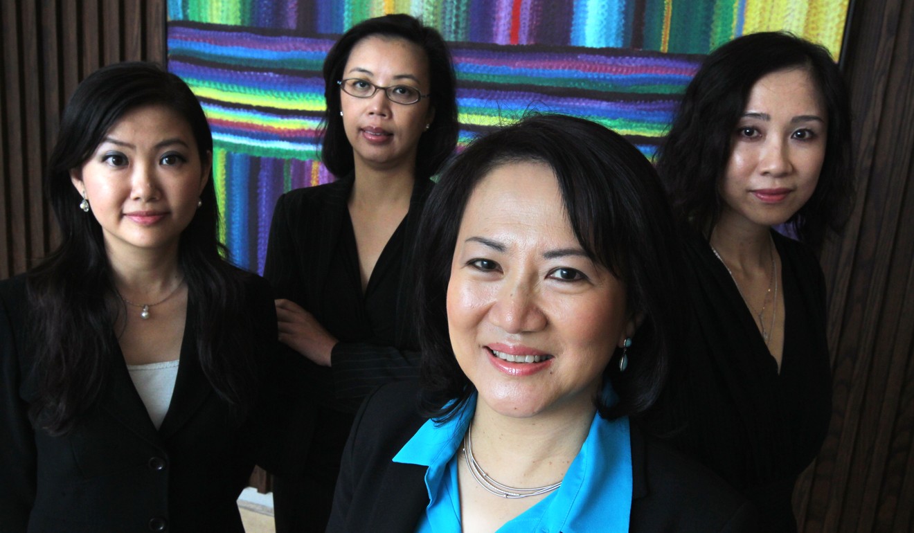 (Left to right) ANZ Bank’s Flora Leung, head of retail banking; Loretta Ko, head of financial institutions group; Susan Yuen, then Hong Kong CEO; and Eliza Wong, head of corporate and institutional relationships, at their office in Exchange Square, Central, in September 2012. At present, Hang Seng Bank is the only Hong Kong blue-chip company with a female CEO. Photo: Dickson Lee