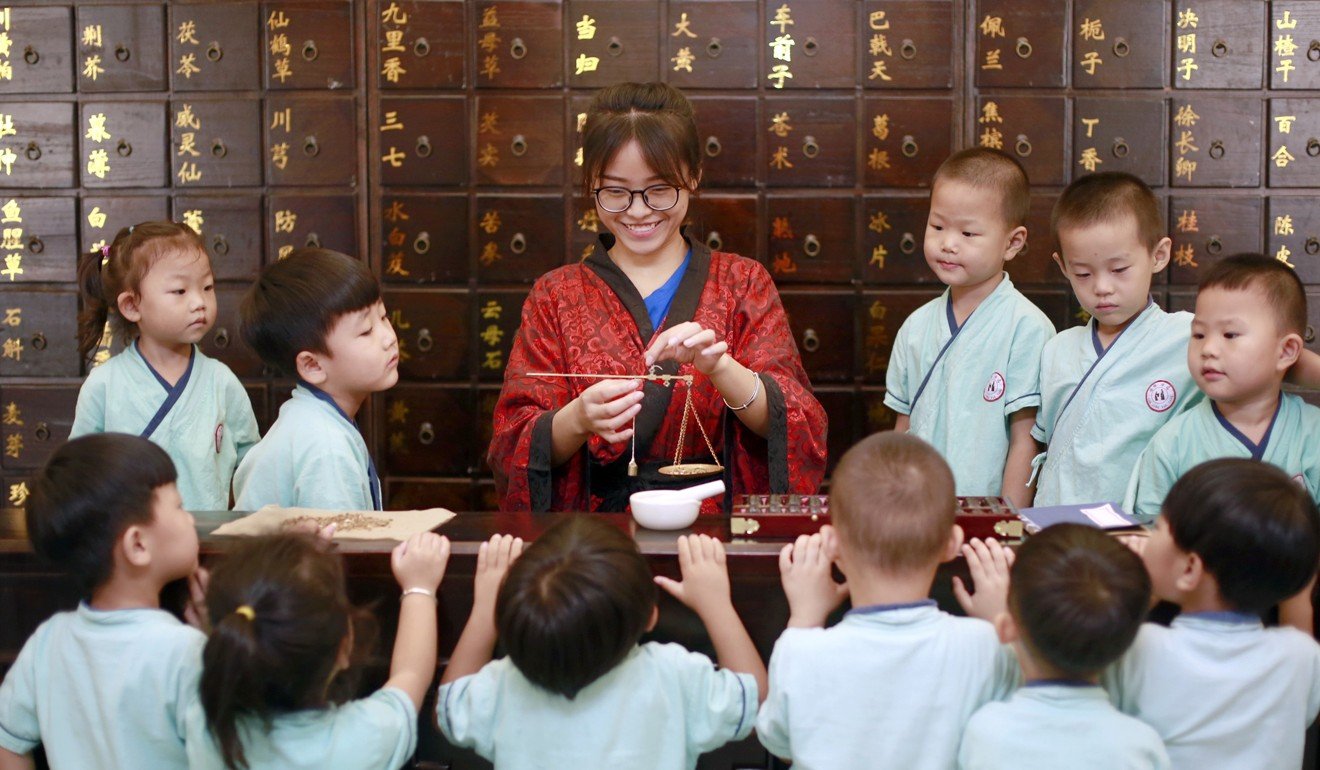 Children learn about traditional Chinese medicine in Hengshui city, Hebei province, in July 2017. Mandarin is used to teach all subjects in schools in mainland China. Photo: Xinhua