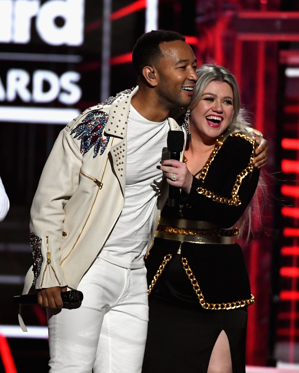 John Legend and Kelly Clarkson onstage during the 2018 Billboard Music Awards. Photo: Ethan Miller/Getty Images/AFP