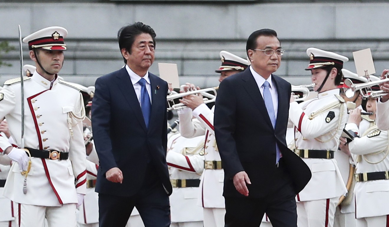 China worked to boost relations with Tokyo ahead of a visit by Premier Li Keqiang (right) to Japan for talks with Japanese Prime Minister Shinzo Abe. Photo: Xinhua