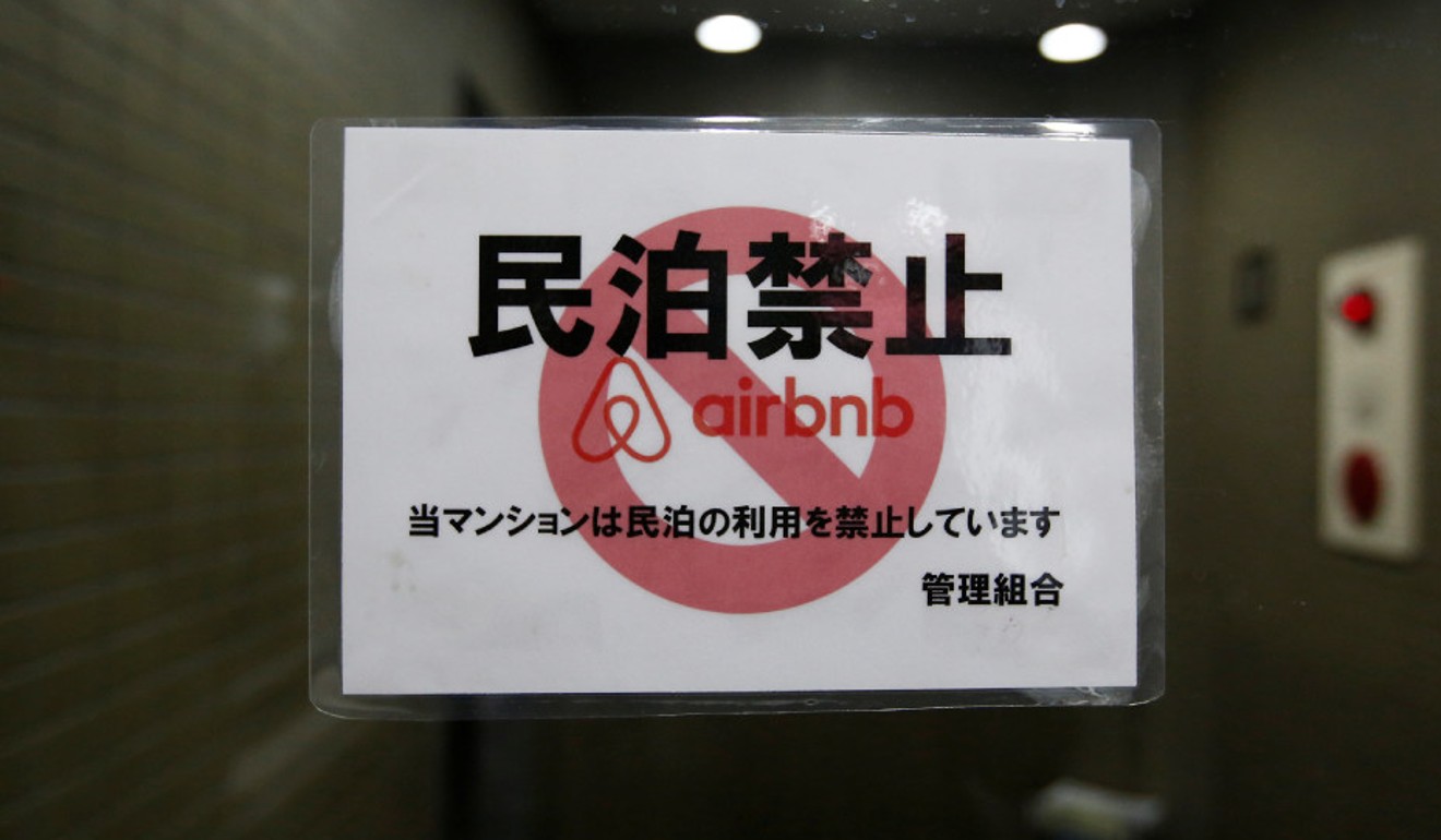 A sign communicating a ban on using flats in a Tokyo building for Airbnb rentals. Picture: Reuters