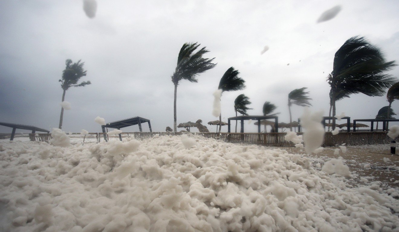 Debris and sea foam litter a beach after Cyclone Mekunu in Salalah, Oman. Photo: AP