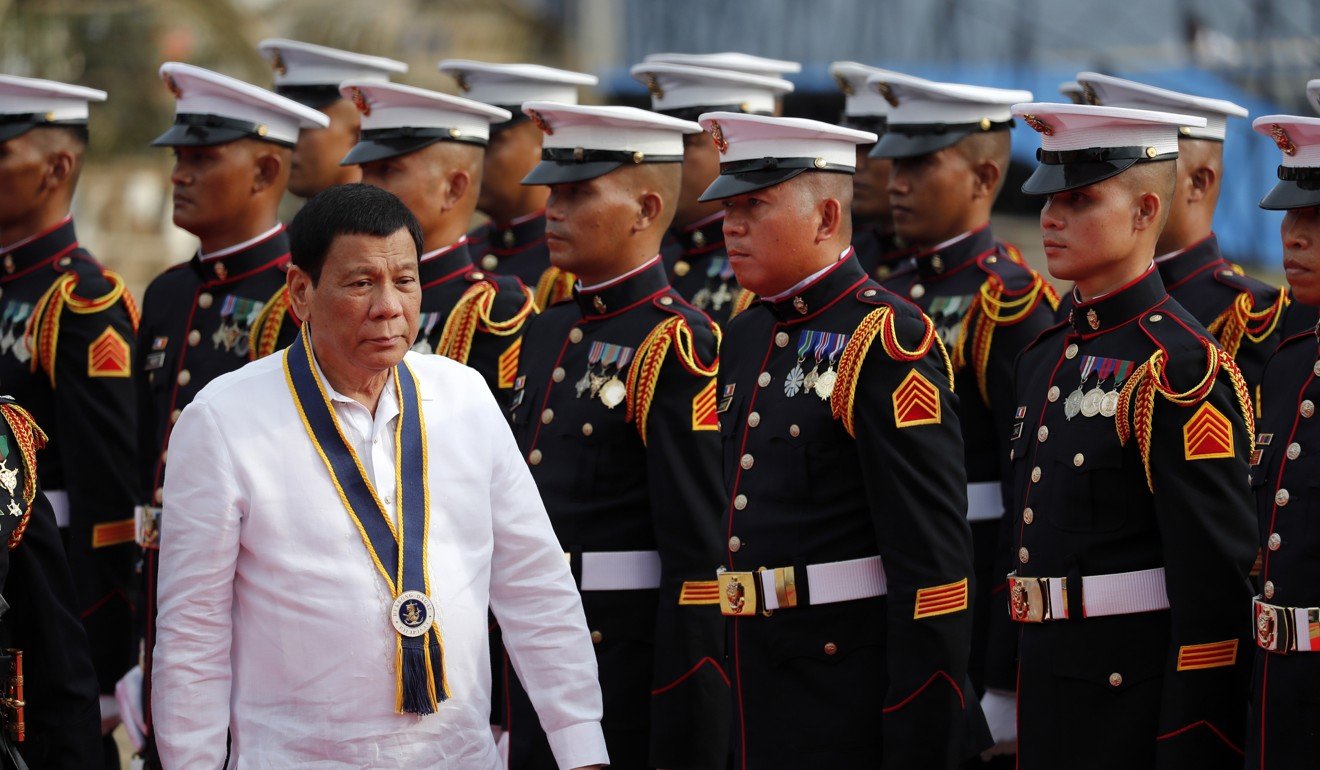 Philippines President Rodrigo Duterte reviews honour guards during the 120th Philippine navy anniversary celebration in Manila. Photo; EPA