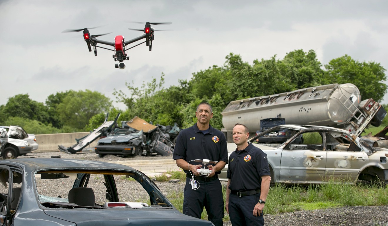 Captain Greg Pope (left) and firefighter Coitt Kessler of the Austin (Texas) Fire Department demonstrate flying a DJI Inspire 1 drone at the department’s training academy in 2017. Photo: Austin American-Statesman via AP