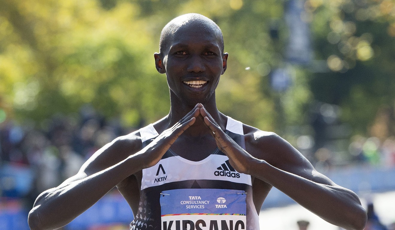 Wilson Kipsang of Kenya celebrates at the finish line after winning the New York City Marathon in November 2014. He, and other successful Kenyan athletes, have used success in athletics to make a better future for themselves in their home country. Photo: EPA
