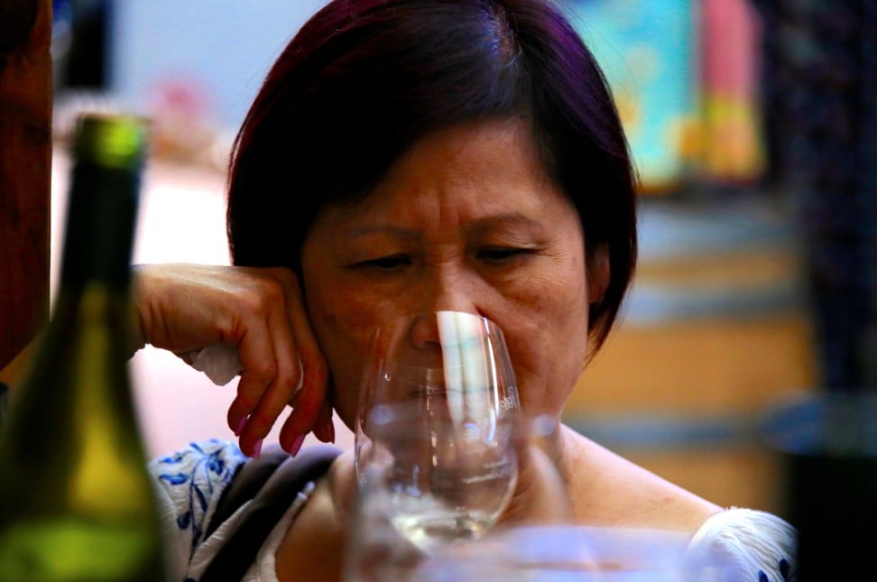 A Chinese woman drinks wine during a tasting at Petersons Winery in Australia’s Hunter Valley. Photo: Reuters
