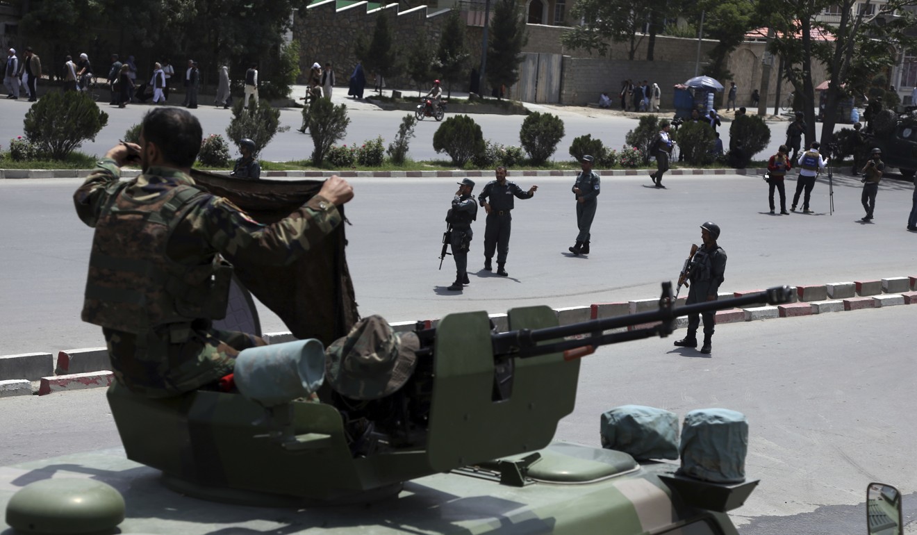 Afghan security personnel at the scene. Photo: AP
