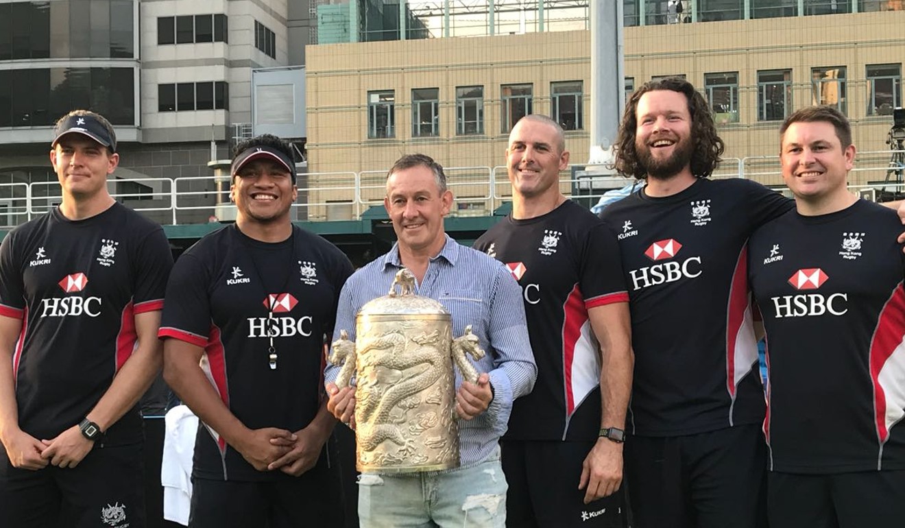 Hong Kong coach Leigh Jones (centre) and his assistants with the Asia Rugby Championship spoils. Photo: Andrew McNicol