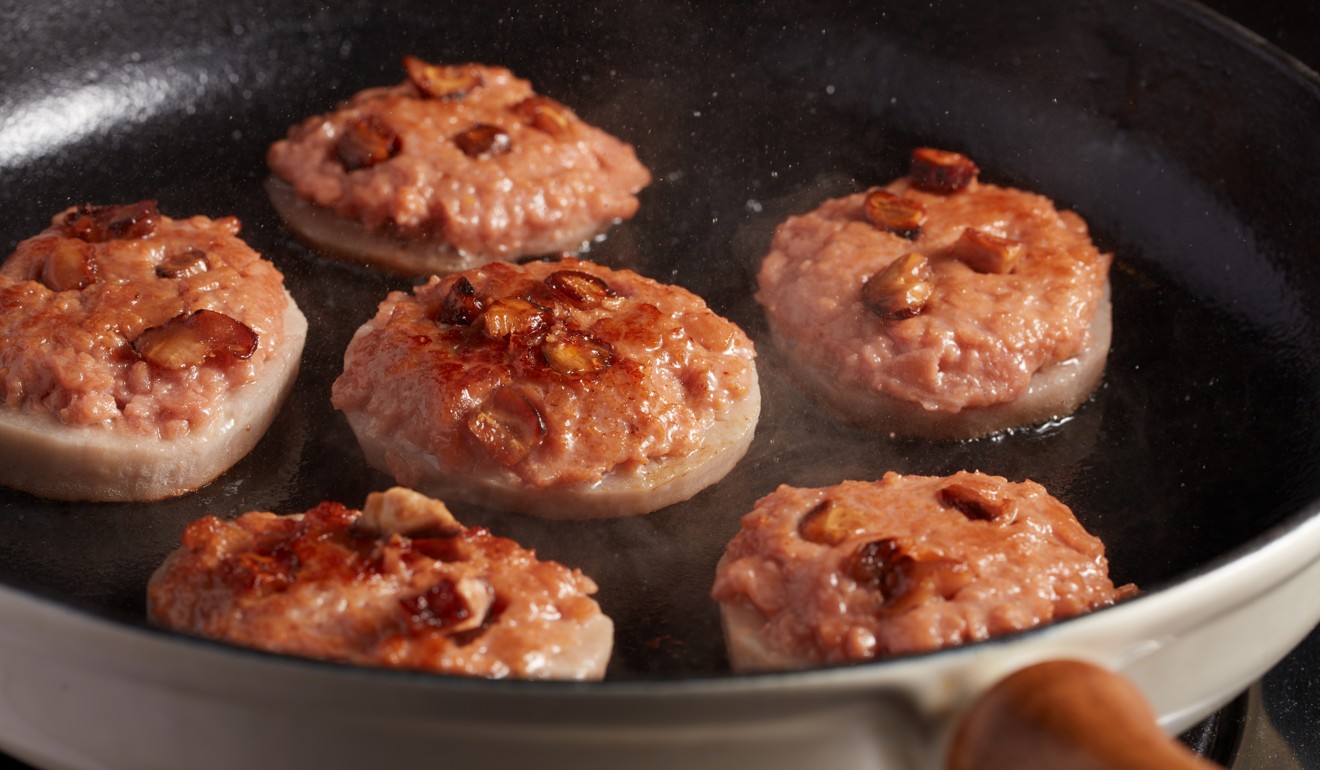 Pan-fried stuffed Omnipork lotus patty.