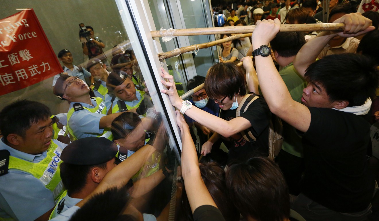 Activists clash with police outside the Legco building in 2014. Photo: Felix Wong