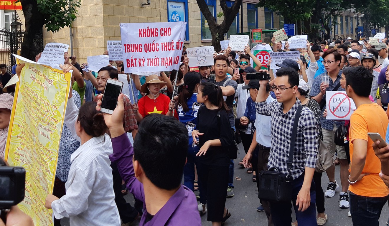 Protesters hold a banner which reads ‘No Leasing Land to China’ during a demonstration against a draft law on the Special Economic Zone in Hanoi. Photo: Reuters