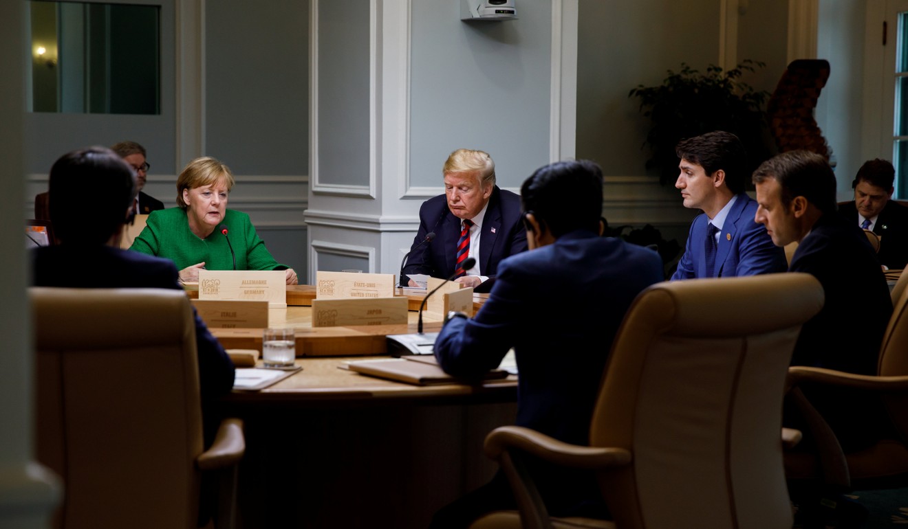 Canada's Prime Minister Justin Trudeau and G7 leaders France's President Emmanuel Macron, Germany's Chancellor Angela Merkel, Japan's Prime Minister Shinzo Abe and US President Donald Trump take part in a working session on the first day of the G7 meeting. Photo: Reuters