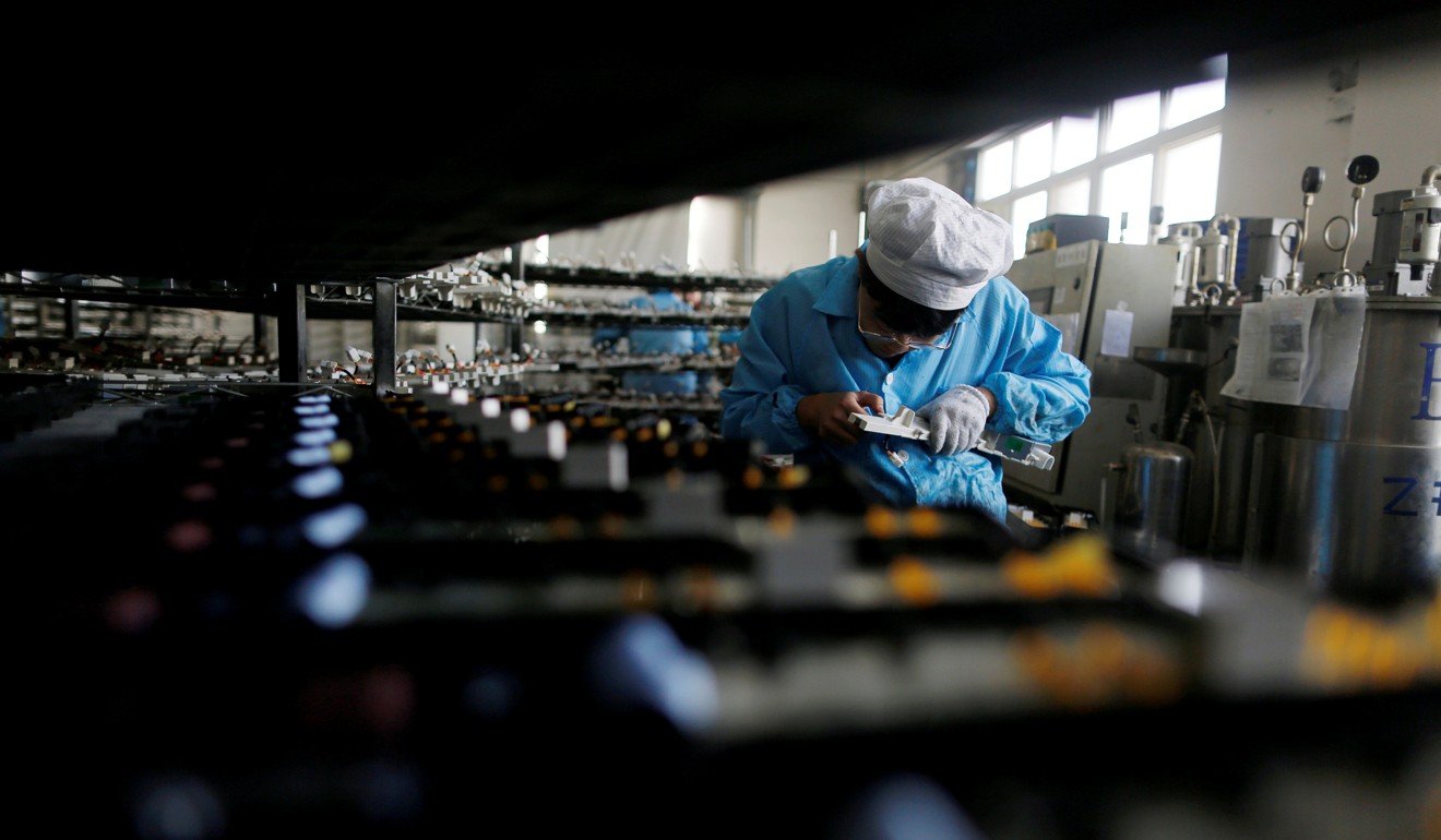 A file picture of a worker at an electronics factory in Qingdao, Shandong province. Photo: Reuters