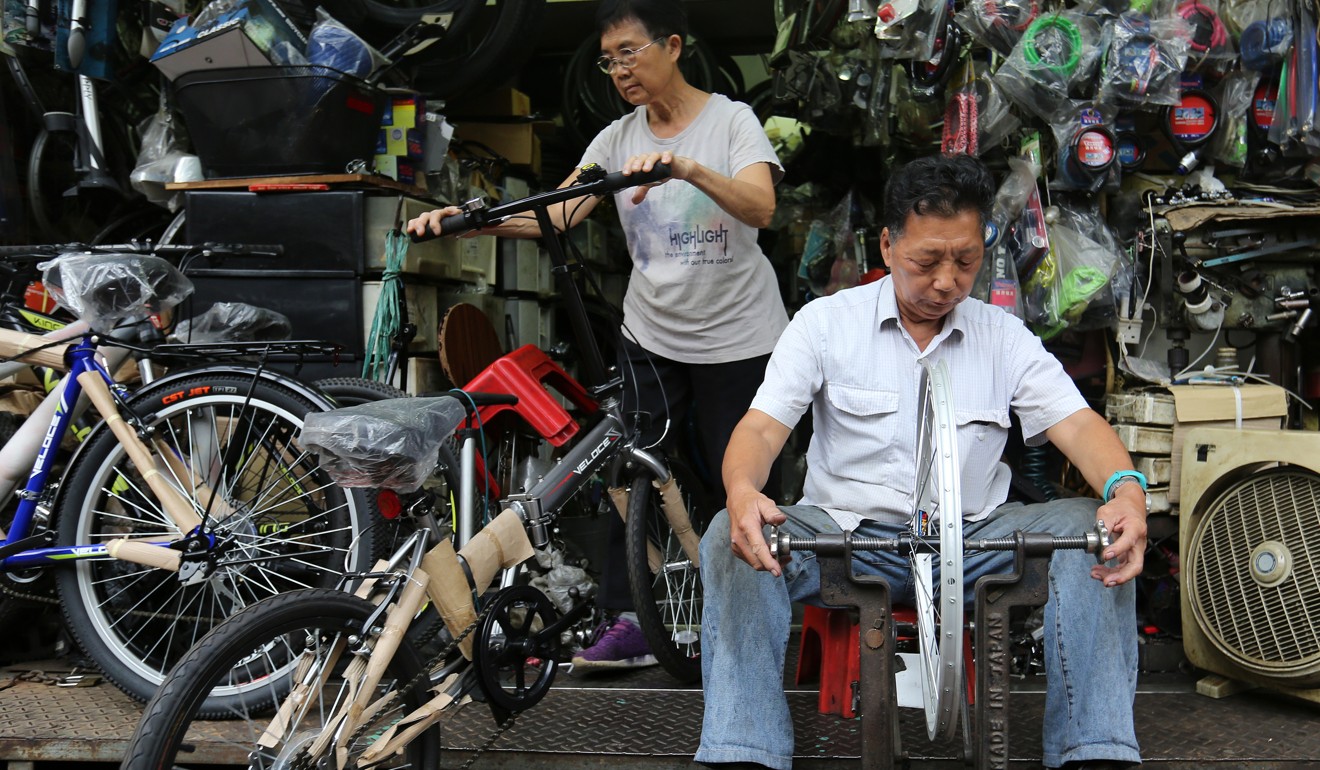 Chung Hon-keung learned the trade of bicycle repair from his father and now updates his skills by watching YouTube videos. Photo: Xiaomei Chen