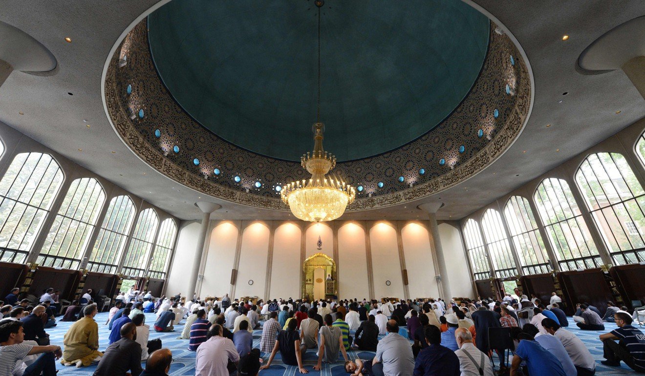 Muslim men attend prayers on Eid al-Fitr at the London Central Mosque. Photo: AFP