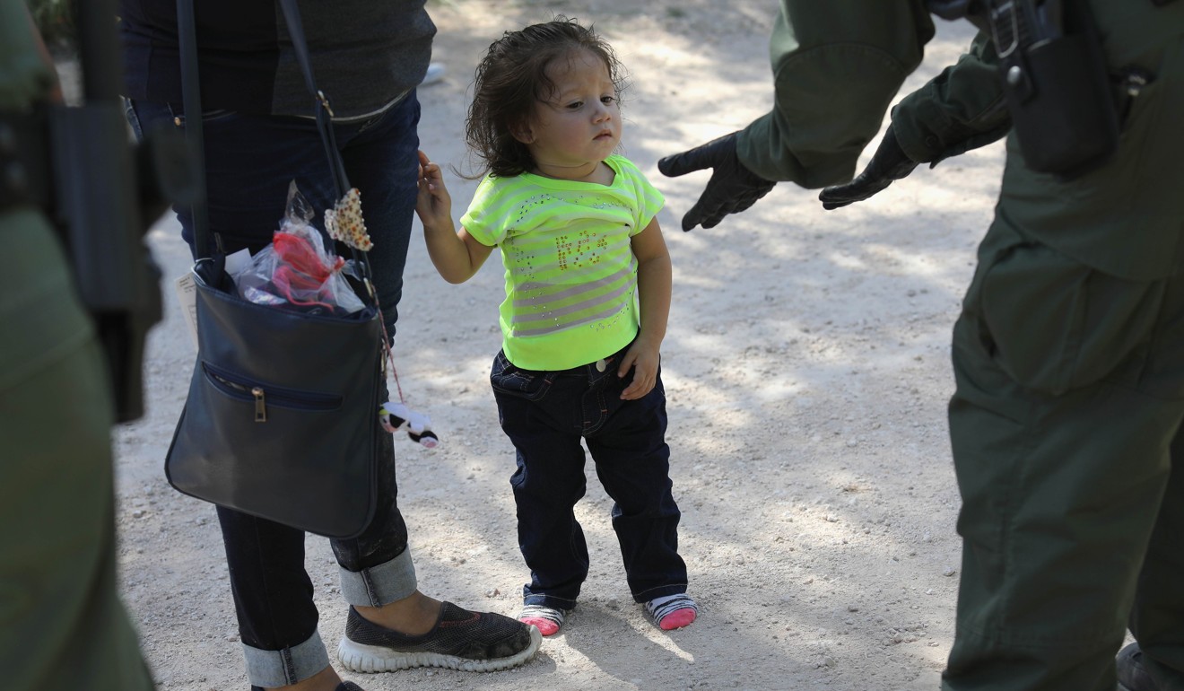 US Border Patrol agents take Central American asylum seekers into custody on June 12 near McAllen, Texas. Photo: Agence France-Presse