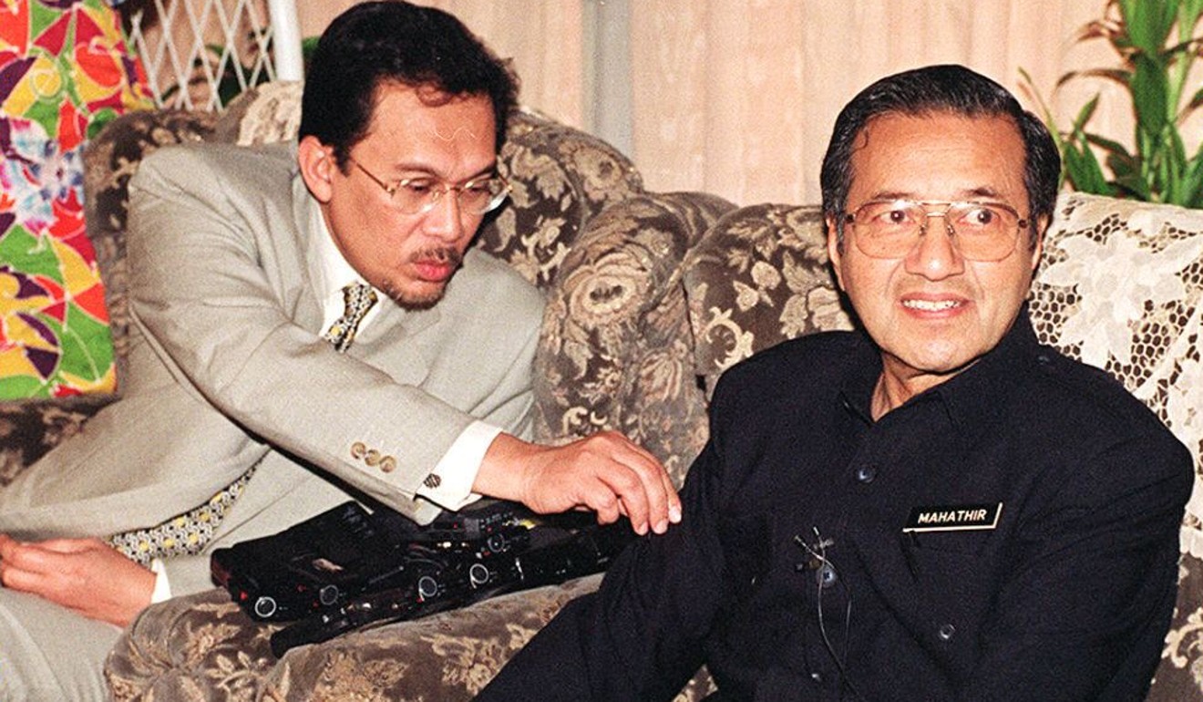 Anwar Ibrahim with Mahathir Mohamad in 1997, during the latter’s first stint as prime minister. File photo