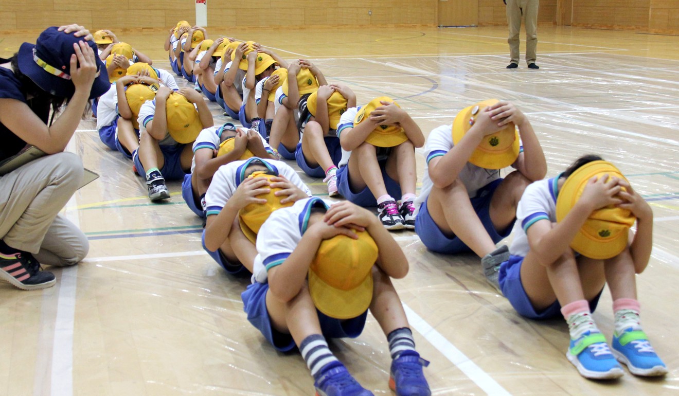 Elementary school students participate in an evacuation drill in Takaoka. Photo: AP